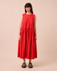 model wears gins chilli red cotton poplin dress