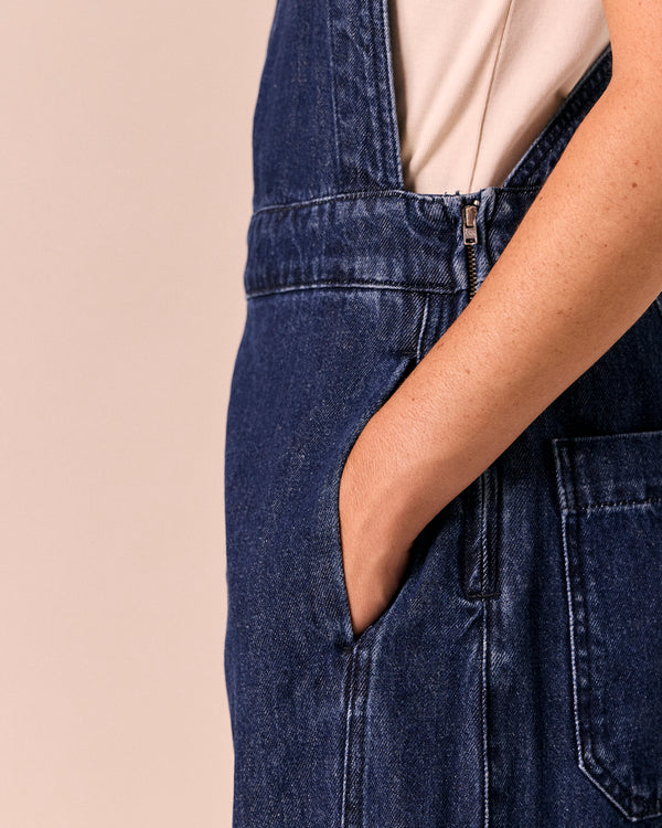 model wears gwynne dark wash denim dungerees