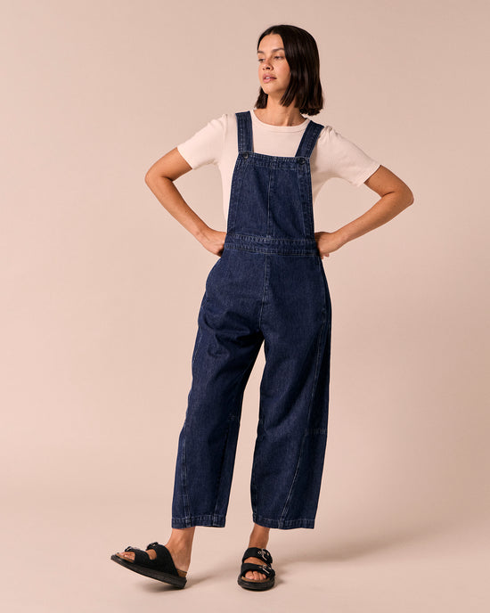 model wears gwynne dark wash denim dungerees