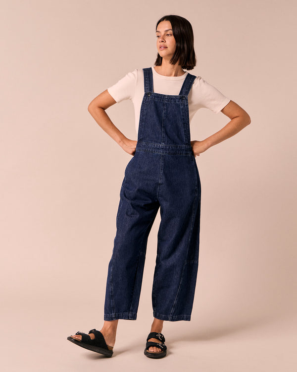 model wears gwynne dark wash denim dungerees