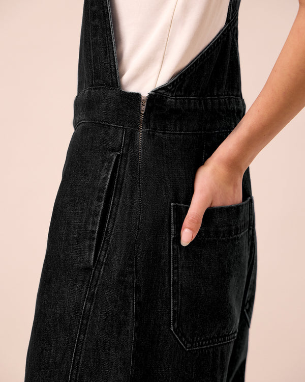 model wears gwynne washed black denim jumpsuit