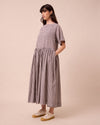 model wears harper ganache gingham cotton linen dress