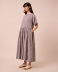 model wears harper ganache gingham cotton linen dress