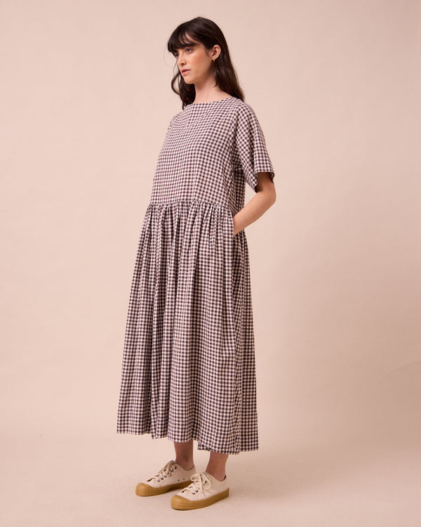 model wears harper ganache gingham cotton linen dress