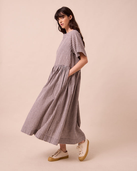 model wears harper ganache gingham cotton linen dress