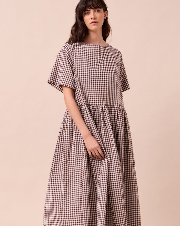 model wears harper ganache gingham cotton linen dress