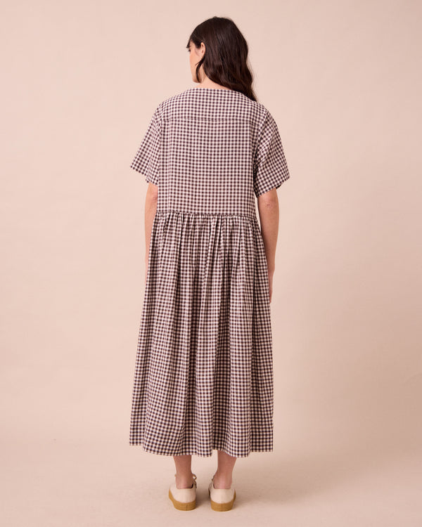 model wears harper ganache gingham cotton linen dress