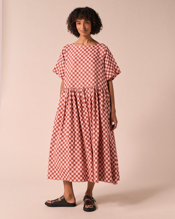 model wears harper rosewood checkerboard linen dress