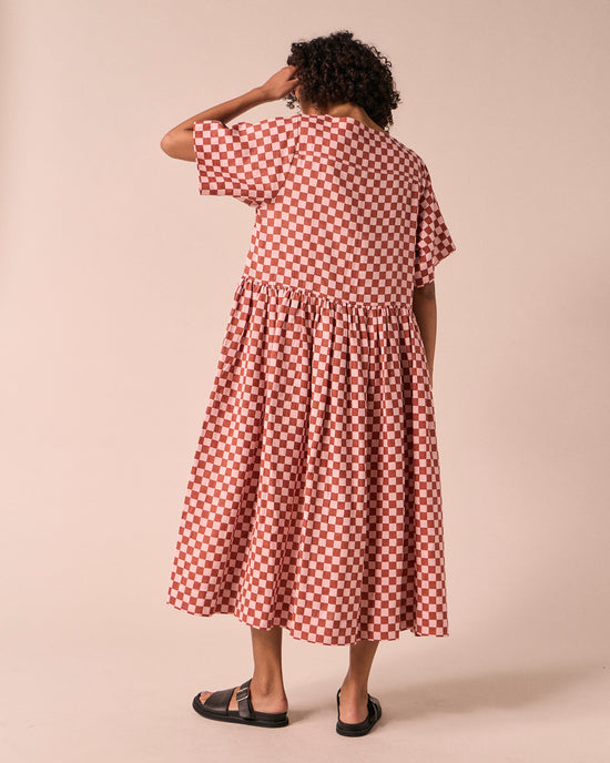 model wears harper rosewood checkerboard linen dress