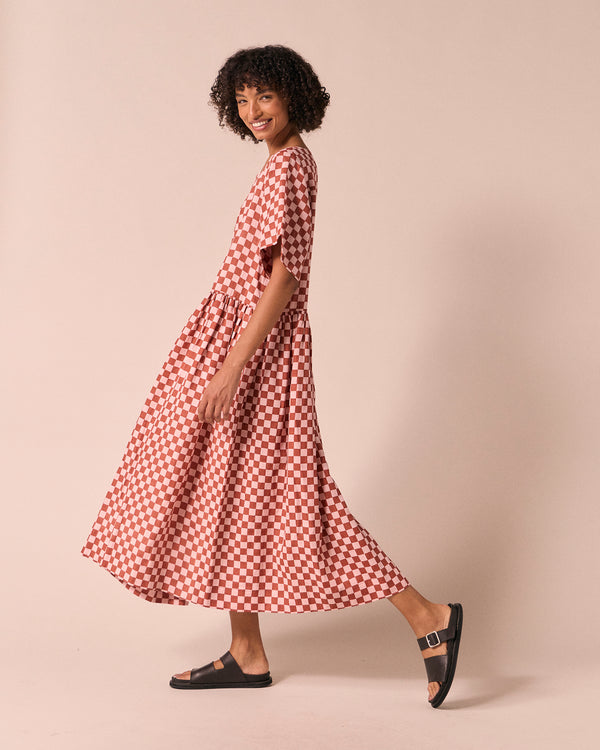 model wears harper rosewood checkerboard linen dress