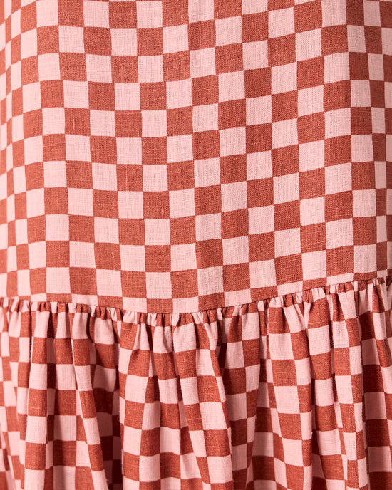 model wears harper rosewood checkerboard linen dress