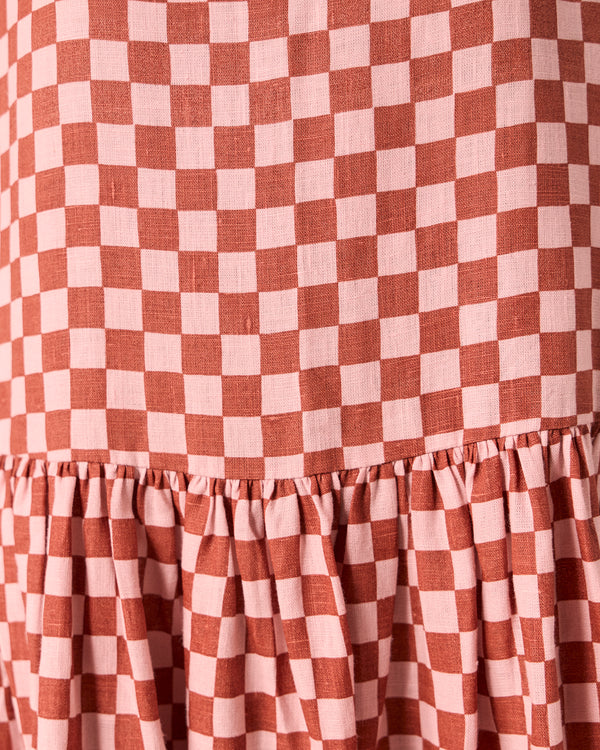 model wears harper rosewood checkerboard linen dress