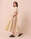 model wears harper bone spot linen dress