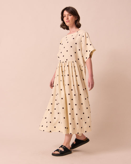 model wears harper bone spot linen dress