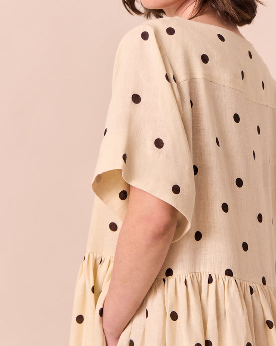 model wears harper bone spot linen dress