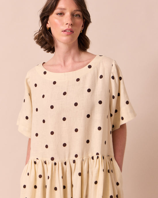 model wears harper bone spot linen dress