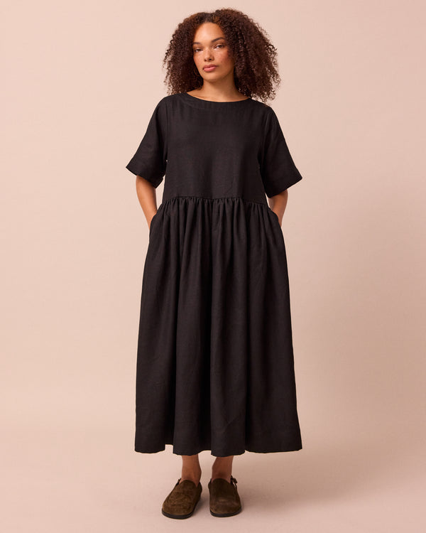 model wears harper black linen dress