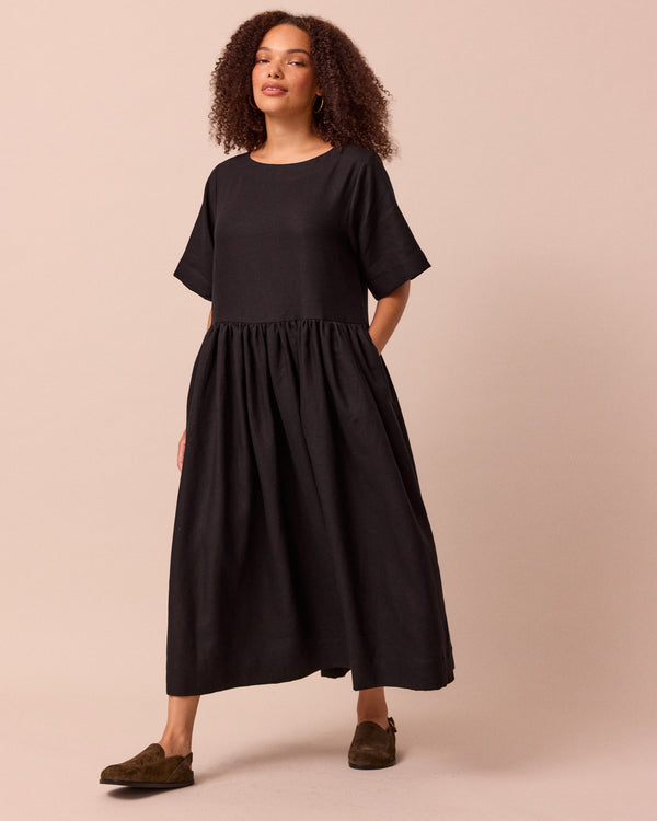 model wears harper black linen dress