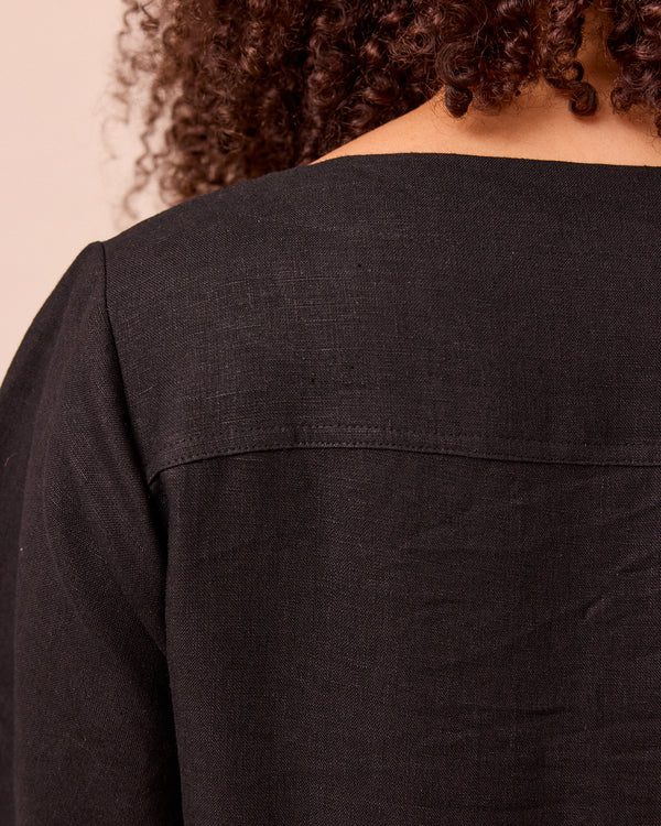 model wears harper black linen dress