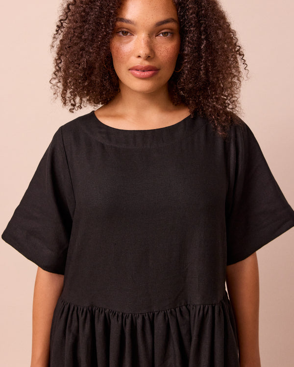 model wears harper black linen dress