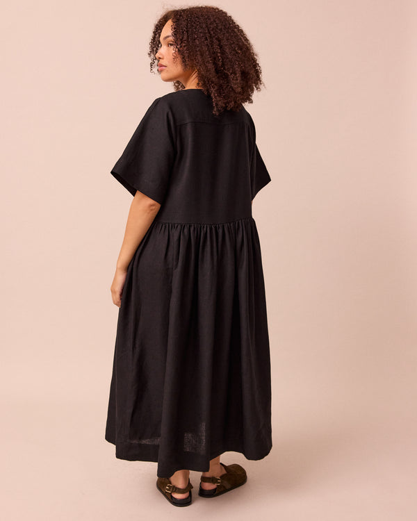 model wears harper black linen dress
