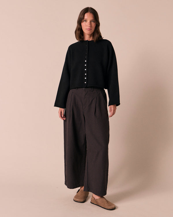 model wears henna black knitted cardigan