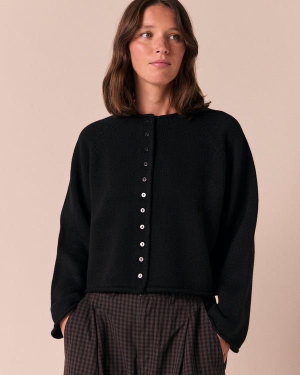 model wears henna black knitted cardigan
