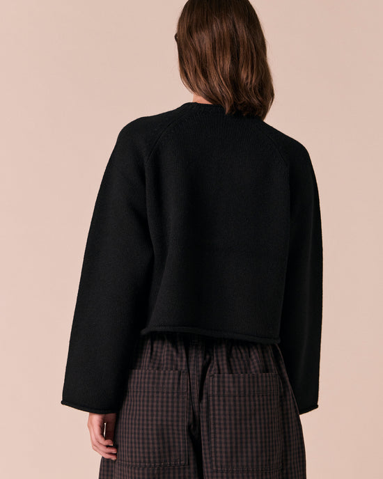 model wears henna black knitted cardigan