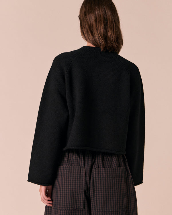 model wears henna black knitted cardigan