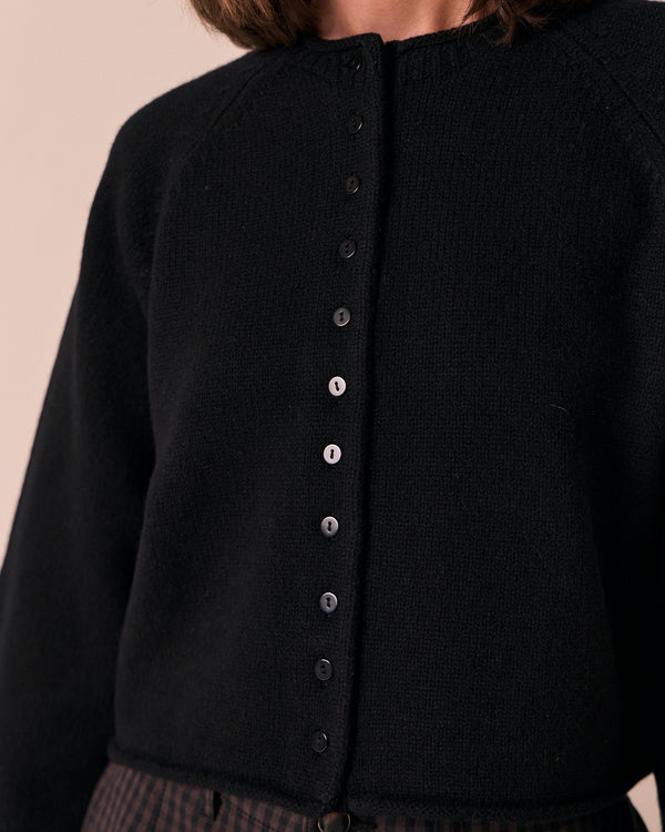 model wears henna black knitted cardigan