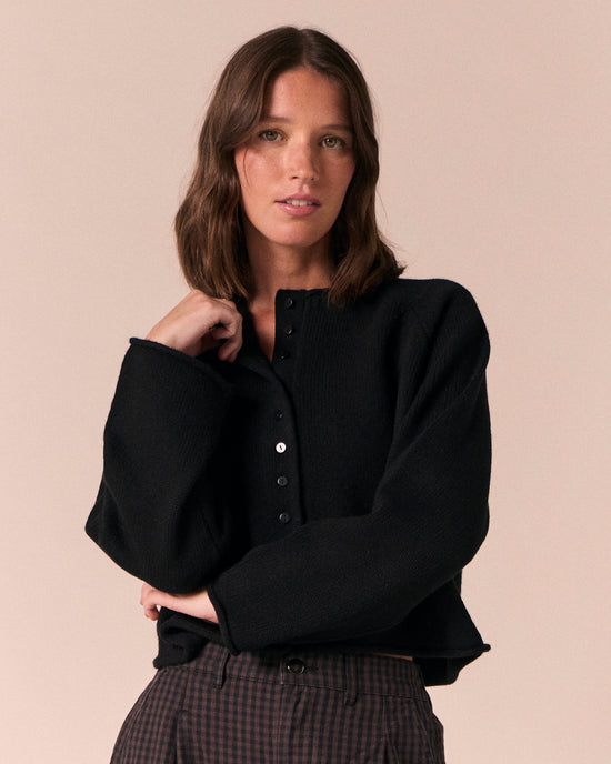model wears henna black knitted cardigan