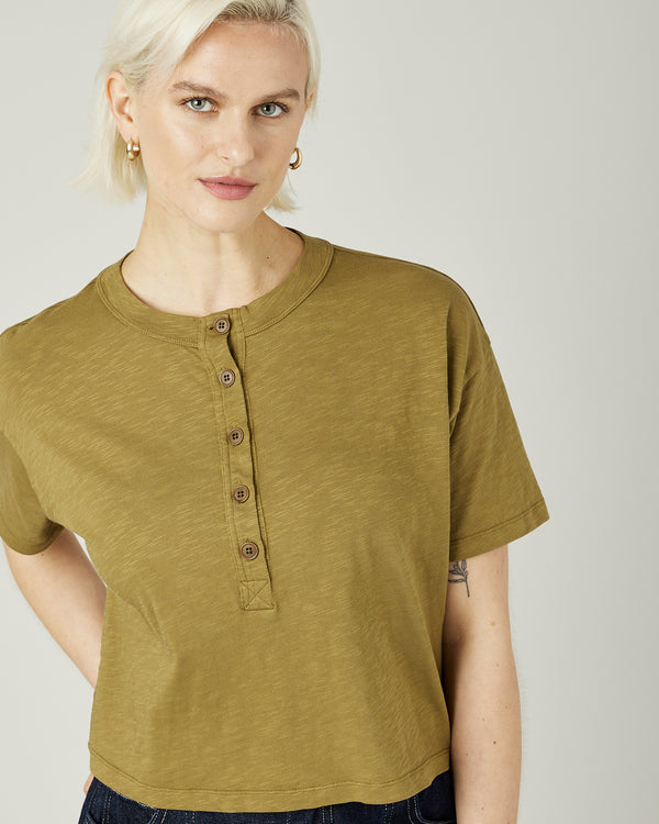 model wears khaki henri top 