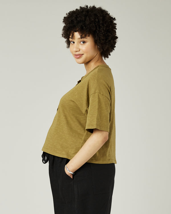 pregnant model wears khaki henri top 