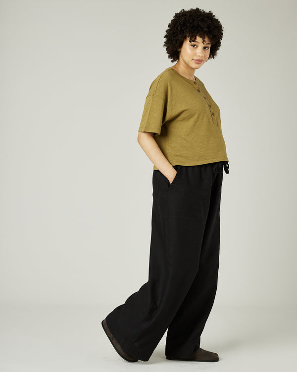 pregnant model wears khaki henri top 