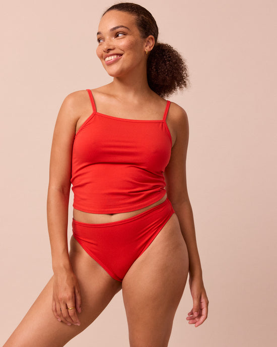 model wears tomato red high rise jersey knicker