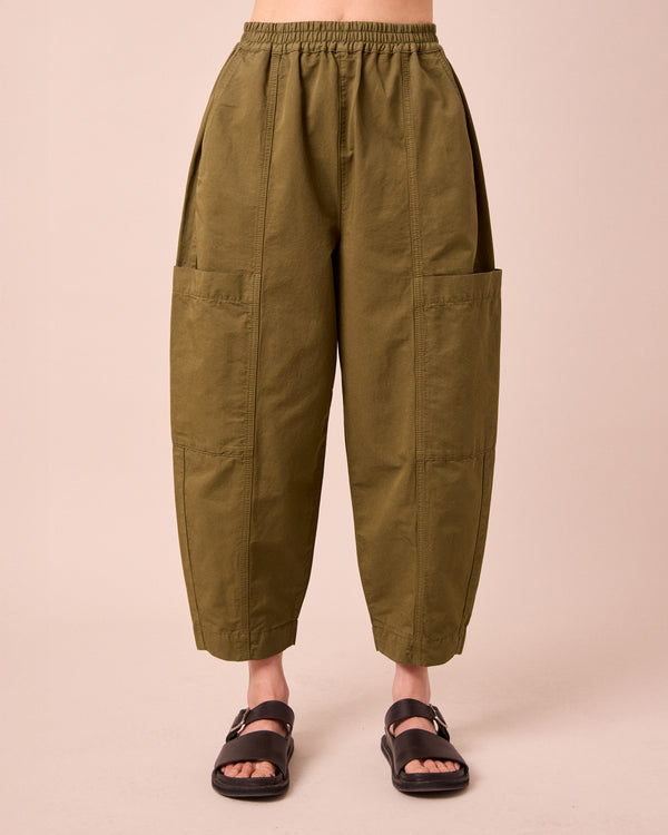 model wears hilda khaki cotton linen trousers front