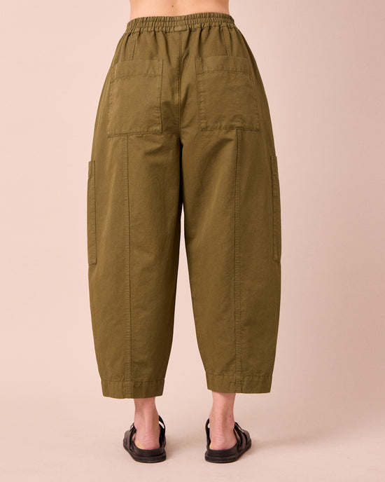 model wears hilda khaki cotton linen trousers back