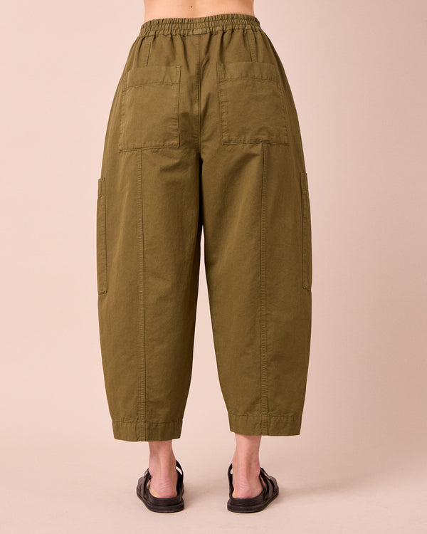 model wears hilda khaki cotton linen trousers back