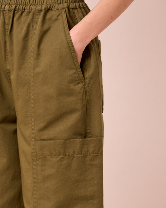 model wears hilda khaki cotton linen trousers 