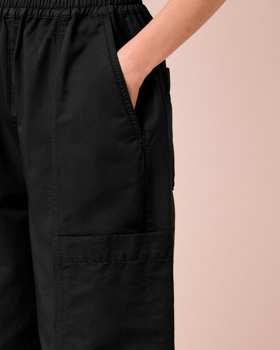 model wears hilda black cotton linen slub trousers 