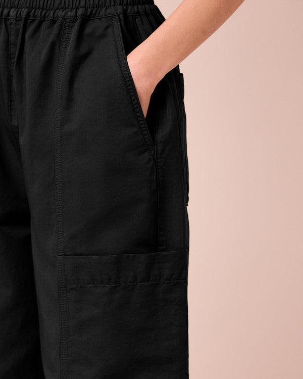 model wears hilda black cotton linen slub trousers 