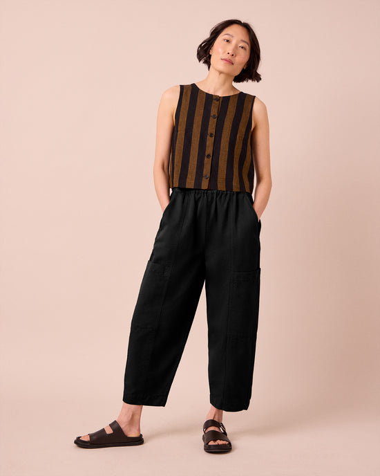 model wears hilda black cotton linen slub trousers right