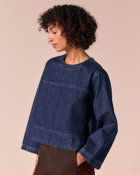 model wears hunter dark wash denim top