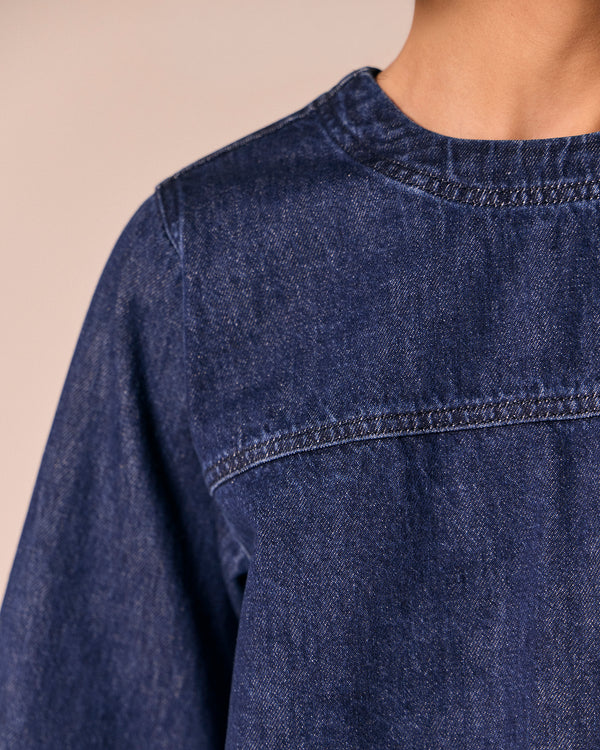 model wears hunter dark wash denim top