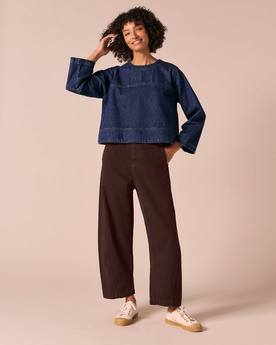 model wears hunter dark wash denim top