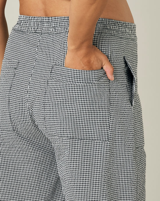 pregnant model wears black and white gingham seersucker huxley trousers