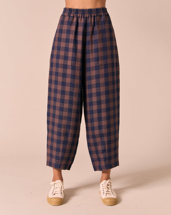model wears huxley cedar check linen trousers front