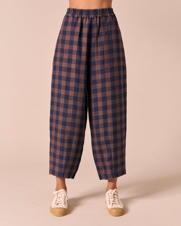 model wears huxley cedar check linen trousers front