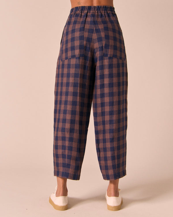 model wears huxley cedar check linen trousers back