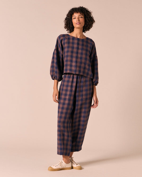 model wears aisha cedar check linen top